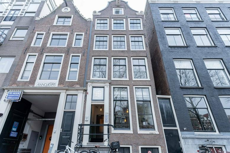 Exterior view of the historic canal house at Herengracht 221, Amsterdam, North Holland.
