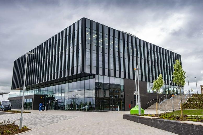 Exterior view of the modern glass and black-ribbed facade of Hill Street, Kilmarnock.