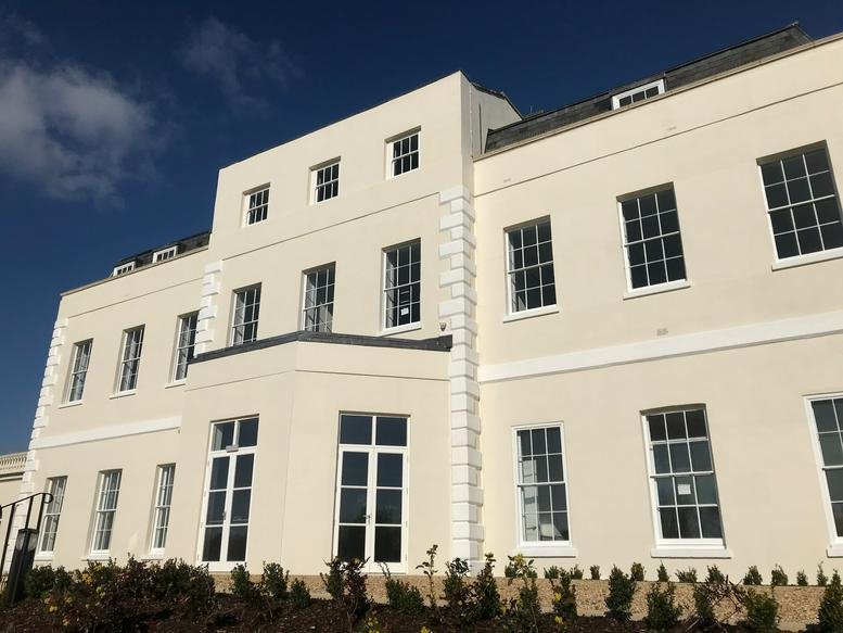 Grand exterior facade of Hillingdon House with classic white architecture and multiple windows.