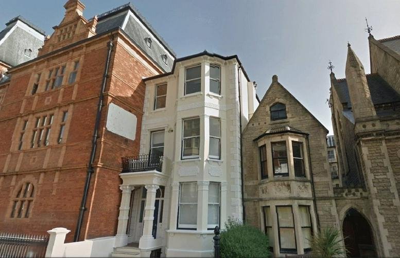 Exterior of the historic brick and stone building at Home Werks, 73 Holland Rd.