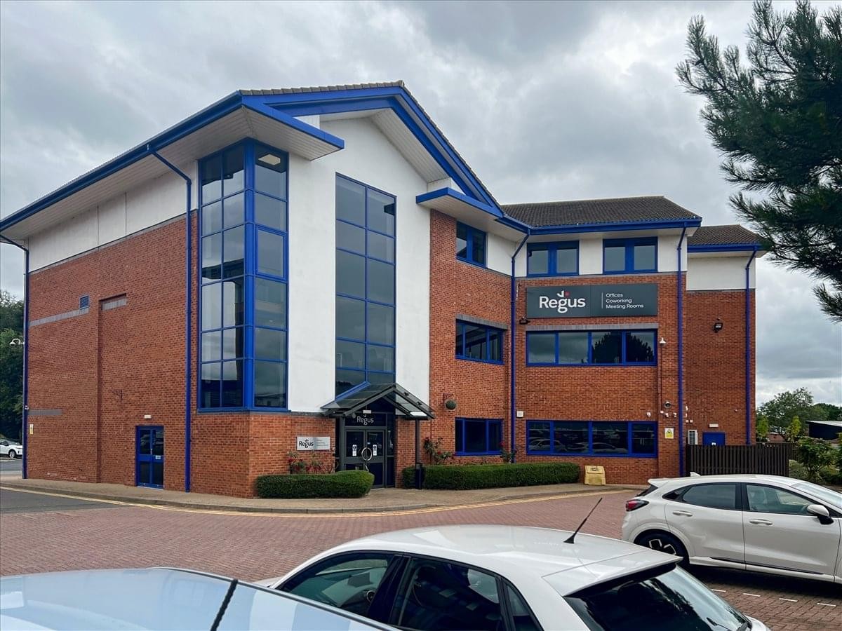 Exterior view of the brick and glass facade at Homer Close, Nicholls House.