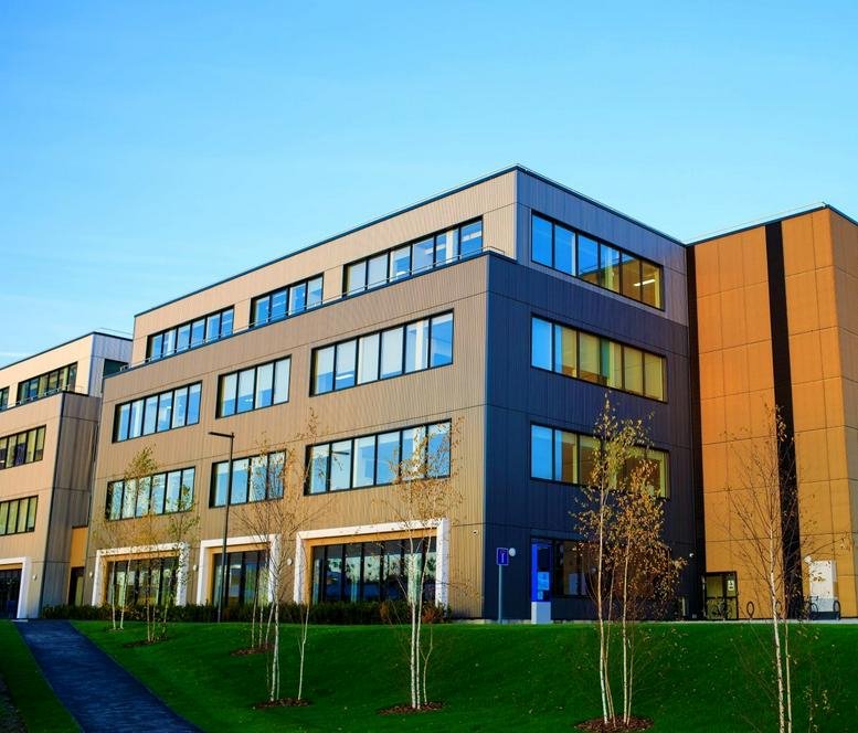Exterior view of the contemporary facade at Imperial College White City Campus, 58 Wood Lane, London.