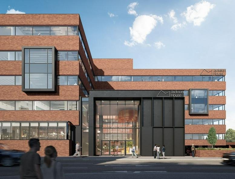 Exterior view of the brick facade and modern glass entrance at Jackson House.