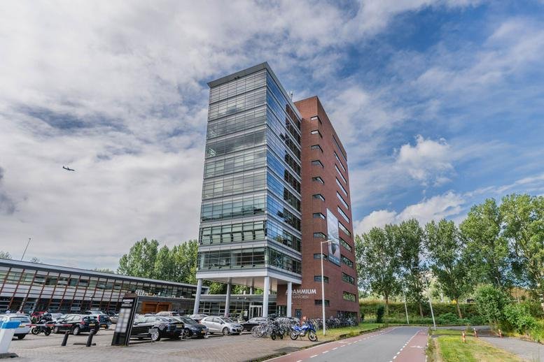 Exterior view of the glass and brick office building at Joop Geesinkweg 201.