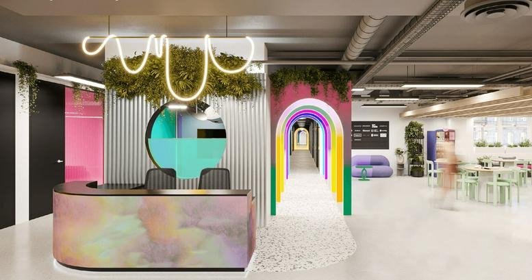 Spacious reception area with a colorful desk, neon light feature, and rainbow arched corridor.