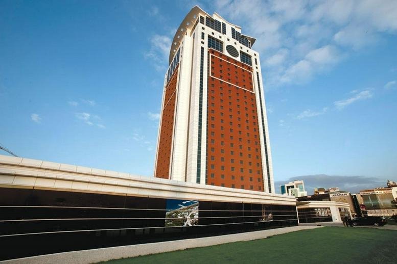 Exterior view of the modern high-rise facade of Flora Suite Office.