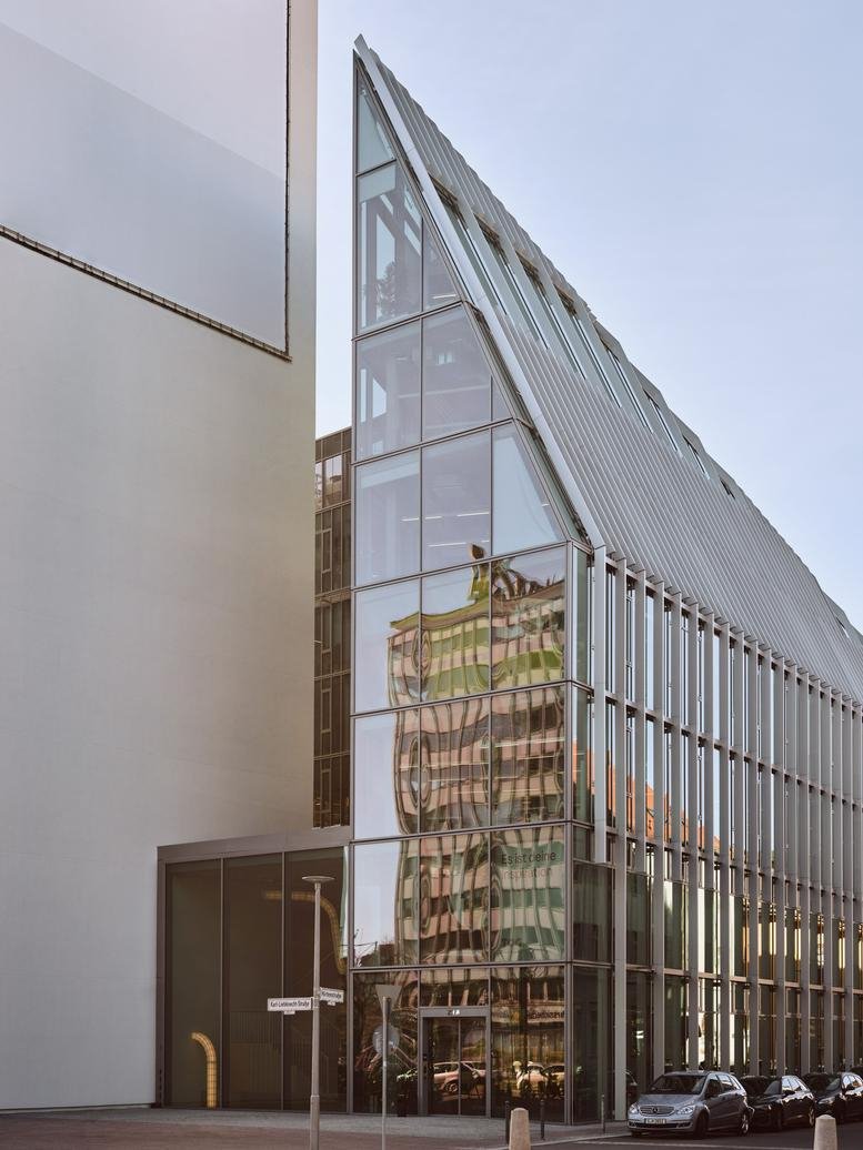 Glass exterior of the modern building at Karl-Liebknecht-Straße 29.