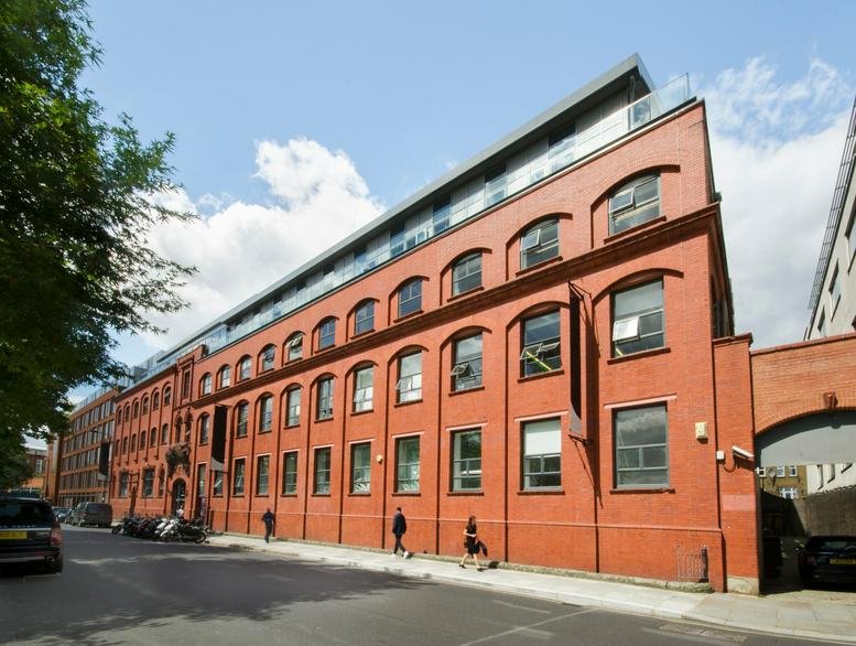 Exterior view of the red brick industrial-style building at Canalot Studios.