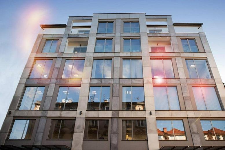 Exterior view of the stone-facade building at Kurniki 9, Krakow, Poland.