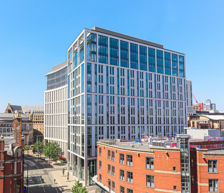 Exterior view of the modern glass and white facade of Landmark St. Peter’s Square.