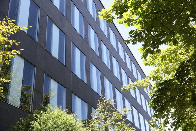Exterior view of the dark facade building with many windows at Landsberger Straße 314.