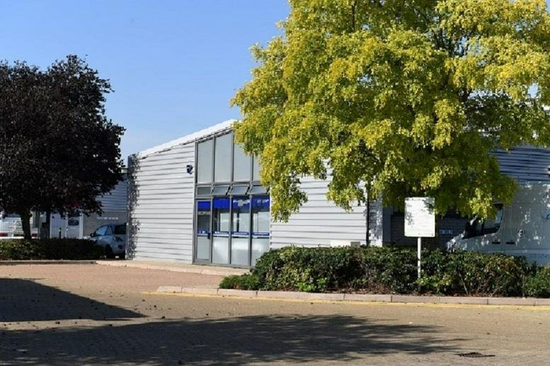 Exterior view of the Loughton Seedbed Centre building with a large green tree in the foreground.