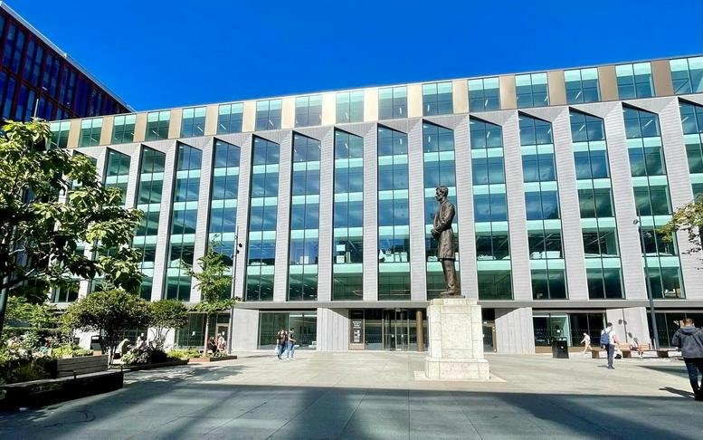 Modern glass-fronted exterior of The Lincoln at Lincoln Square, Brazennose Street.