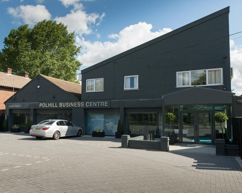 Exterior view of the dark grey facade and entrance at Polhill Business Centre.