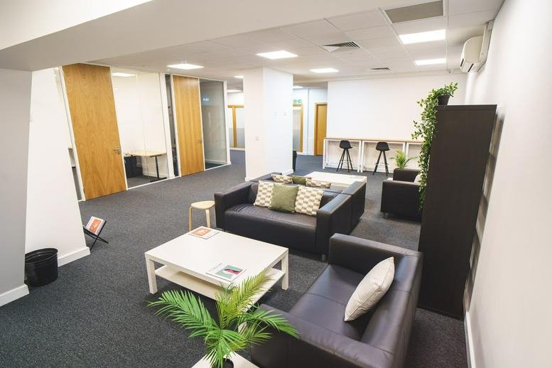 Spacious lounge at Maitland House, Warrior Square, 3rd And 7th Floor, Southend-on-Sea with sofas and plants.