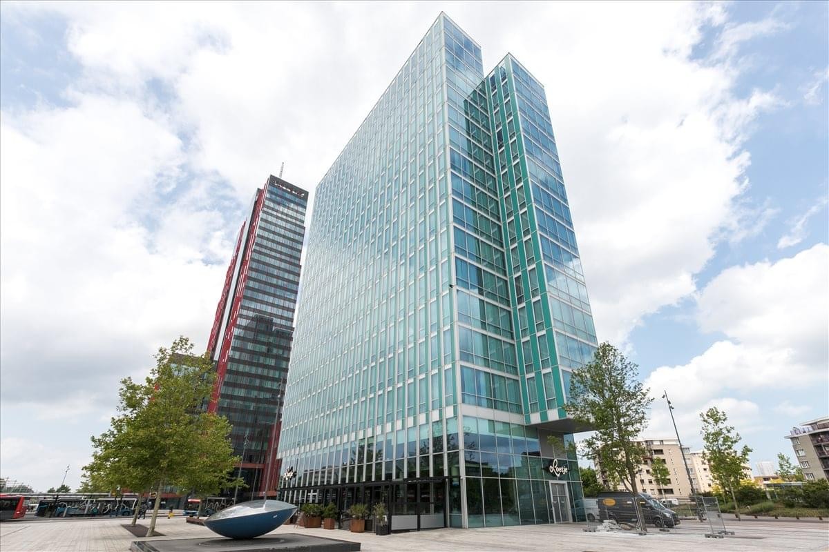 Exterior view of the modern glass-facade towers at Mandela Plein 1.