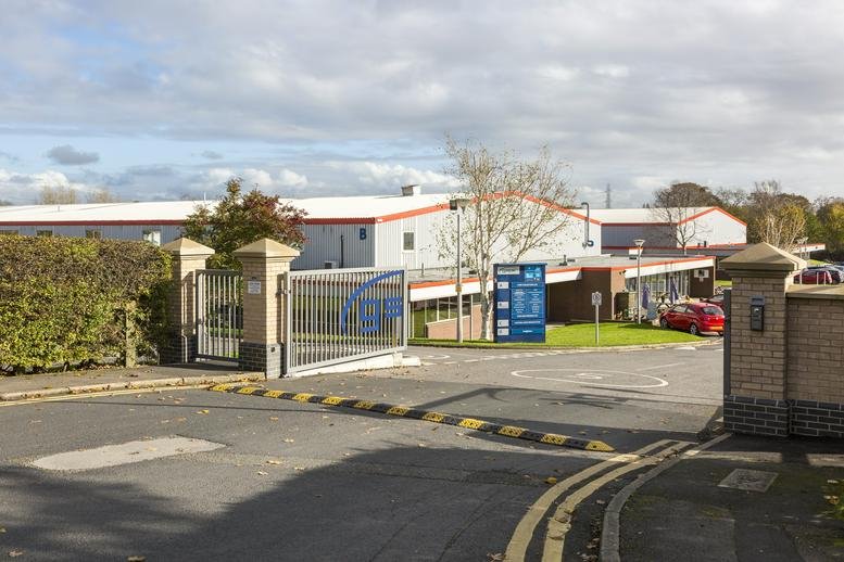 Exterior entrance gate and modern industrial facade at Manse Lane, Knaresborough, North Yorkshire.