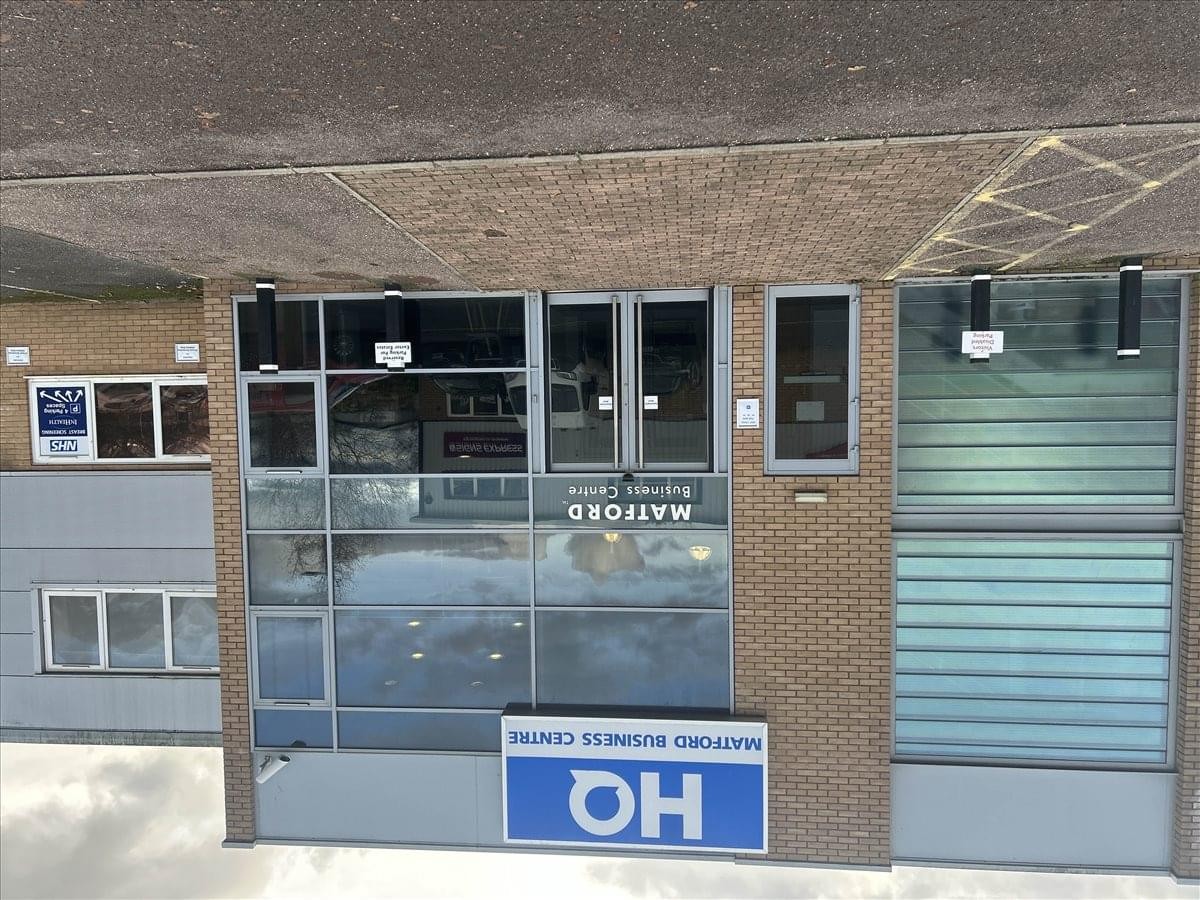 Exterior view of the glass and brick facade at Matford Business Centre.