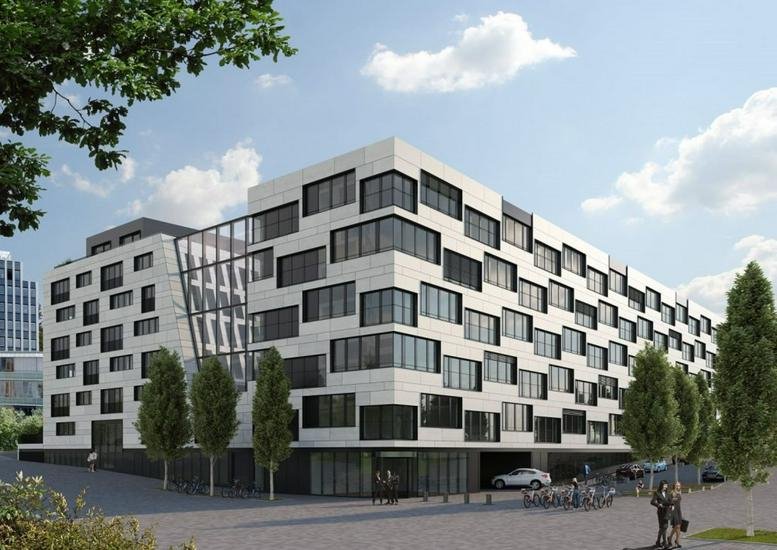 Exterior view of the modern white and glass facade at Maybachstraße 20.