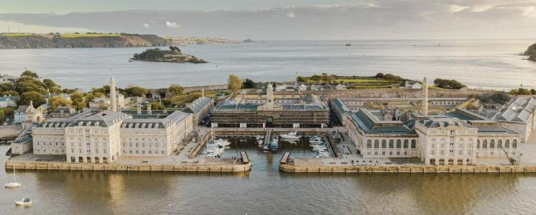 Exterior aerial view of the historic stone Melville building at Royal William Yard, Plymouth.