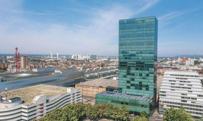 Exterior view of the glass-facade skyscraper at Messeplatz 10, Basel, Switzerland.