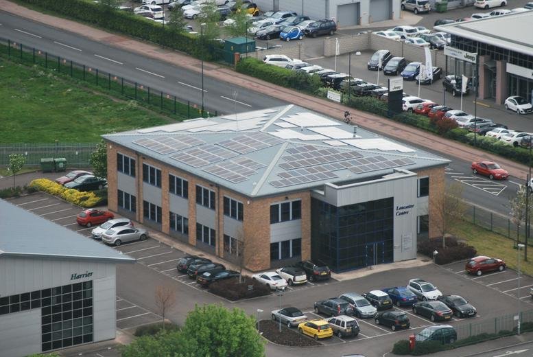 Exterior view of the brick facade and parking at Meteor Business Park, Gloucester.