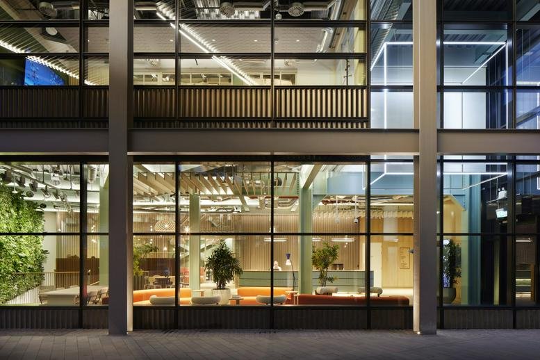 Evening view of the modern glass facade at Montacute Yards.