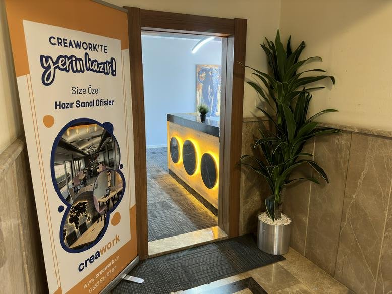 Reception area for Muratpaşa antalya, Antalya showing a warm wood-framed entrance and lit front desk.