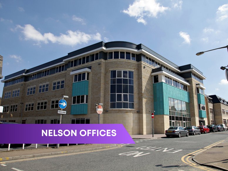 Exterior view of the stone and glass Nelson Business Centre with teal architectural accents.