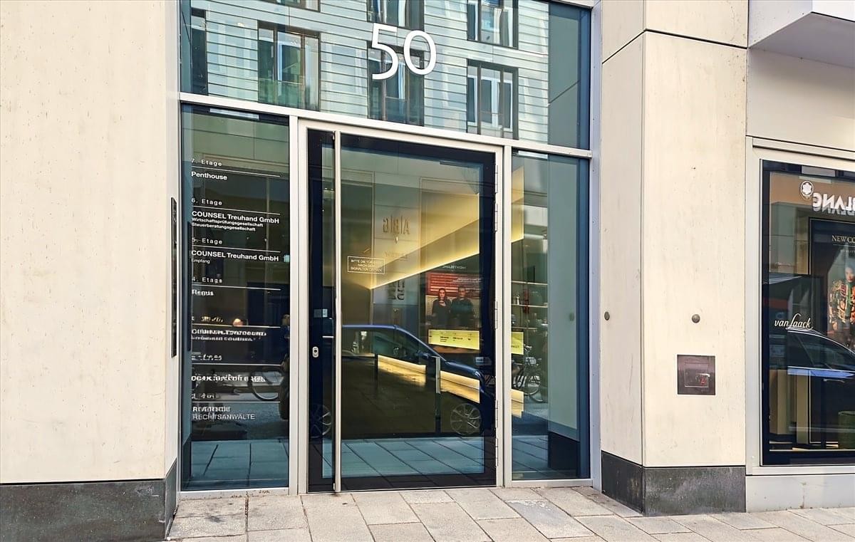 Exterior entrance of Neuer Wall 50, Excellent Business Center with glass doors and number 50 signage.