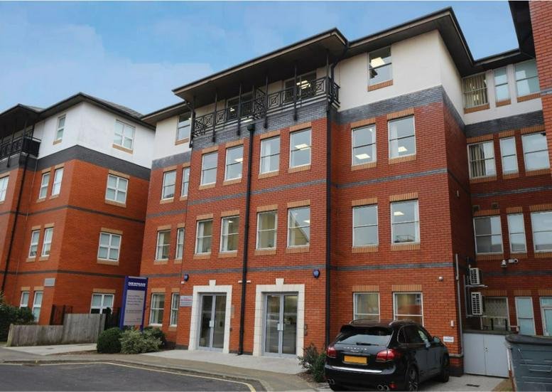 Exterior view of the brick facade at Newman Flexible Workspace, Commercial House.
