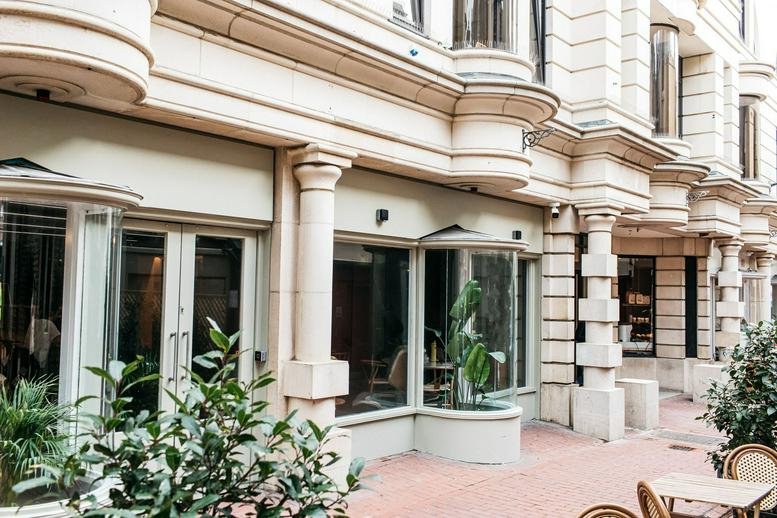 Exterior facade of Nile House, Nile Street, The Lanes with classical stone pillars and large windows.