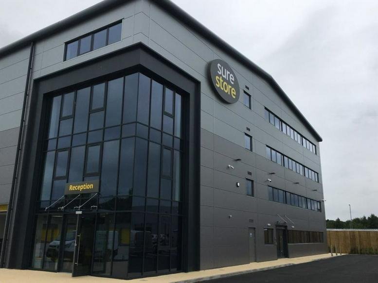 Exterior view of the modern grey and glass facade of Ninth Avenue, Burton Upon Trent, Staffordshire.
