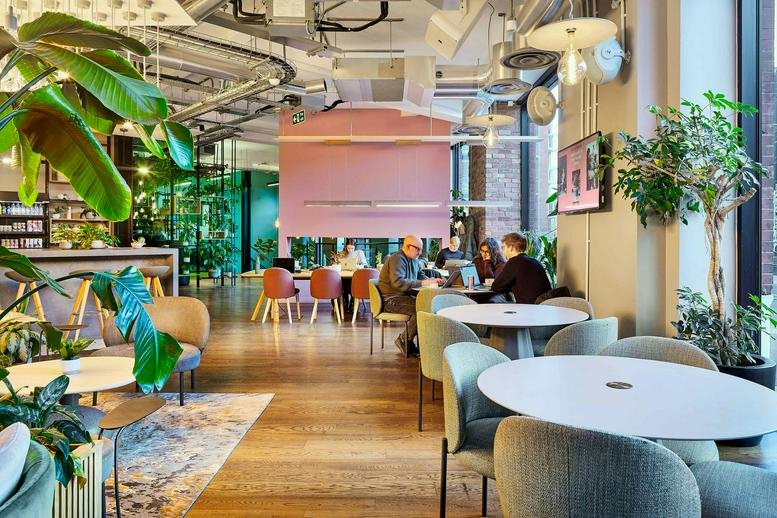 Brick and white stone exterior entrance of 1 Long Lane, Central London.