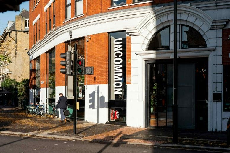 Exterior view of the brick facade and entrance at 1 Long Lane, Central London.