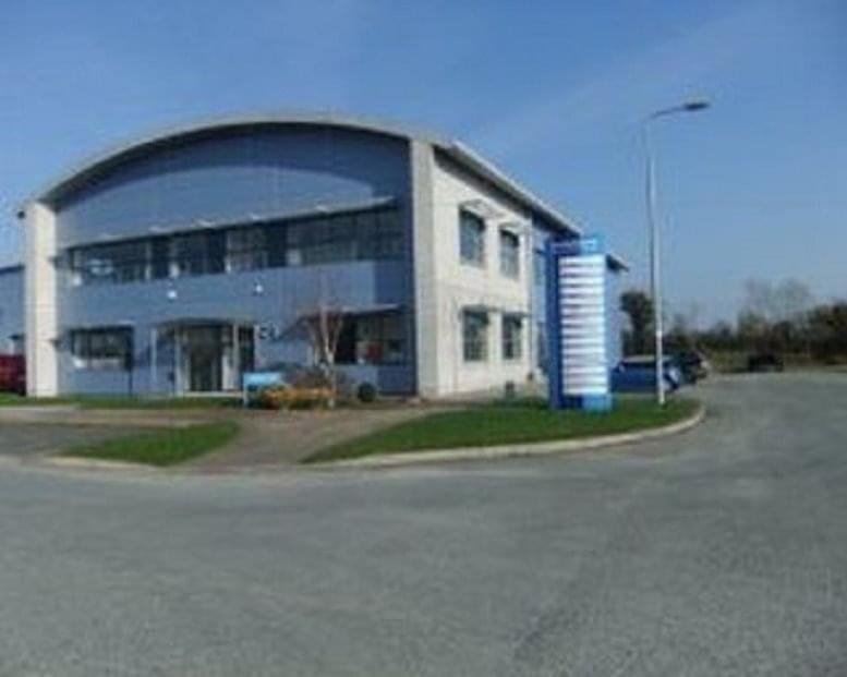 Modern two-story curved facade building at 1 Scurlockstown Business Park, Trim, Ireland.