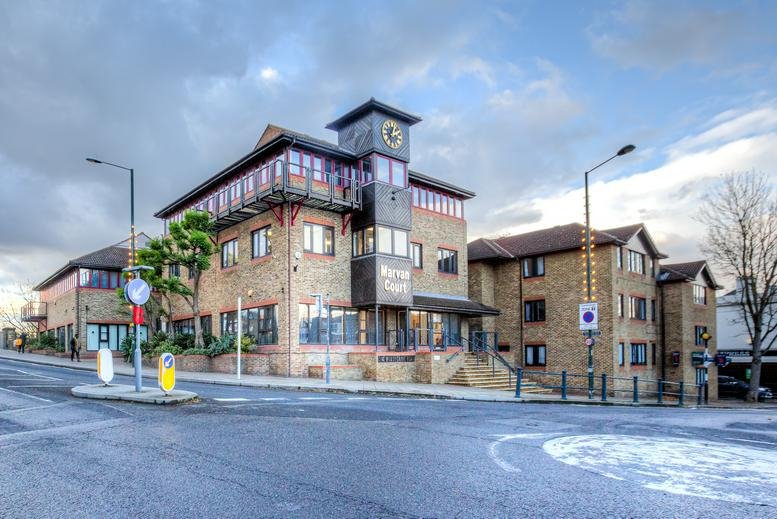 Exterior view of the brick facade and clock tower at Marvan Court, 1 Waldegrave Road.