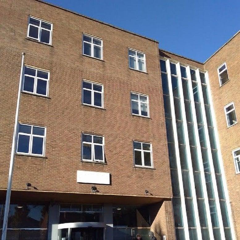 Brick exterior of 101 Lockhurst Lane, Coventry, West Midlands County with large windows.