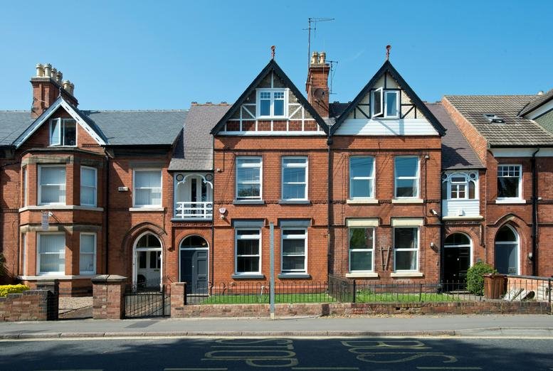 Exterior view of the red brick facade at 105, Ashby Road, Loughborough, Leicestershire.