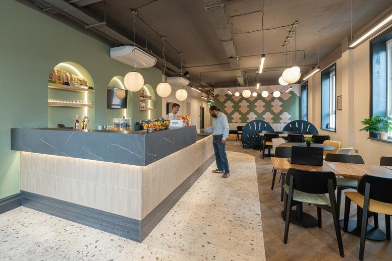 Café and coworking area at Flexworks, 105 Ferensway, City Center, Hull with stone-clad counter and bistro seating.