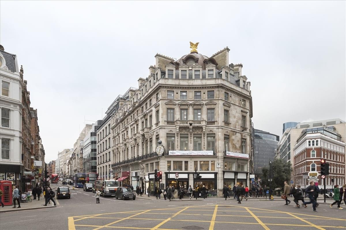 Classic architectural exterior view of 107-111 Fleet Street at a busy London intersection.