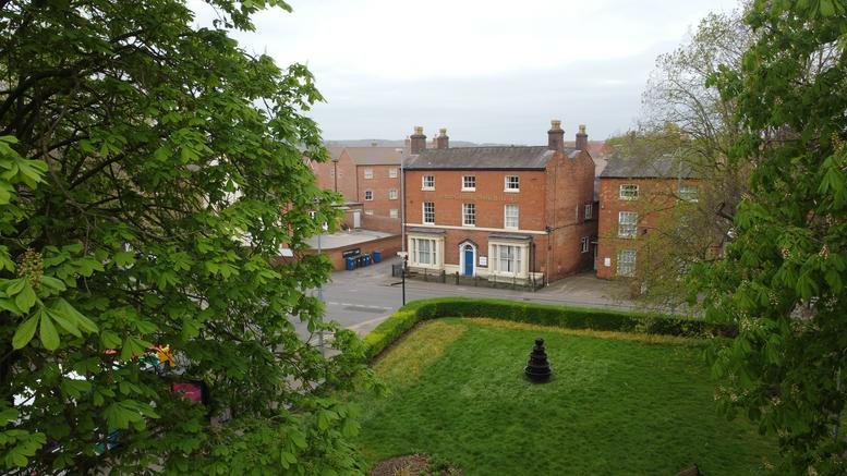 Exterior view of the historic brick building at 11 Aldergate, Town Centre, Tamworth.