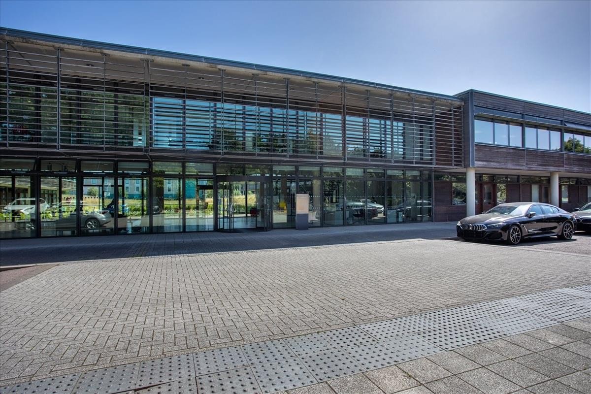 Exterior view of the contemporary glass and wood facade of 110 Butterfield, Luton.