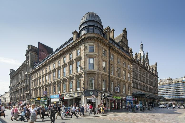Exterior view of the historic corner building at 111 Union Street, Glasgow, Scotland.