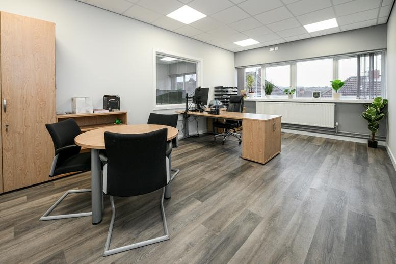 Spacious private office at Queen Street Business Centre with large windows and wooden flooring.