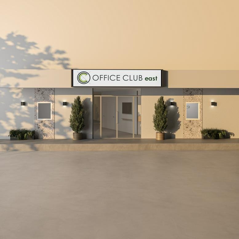 Exterior view of the storefront entrance for Office Club East in Thessaloniki.