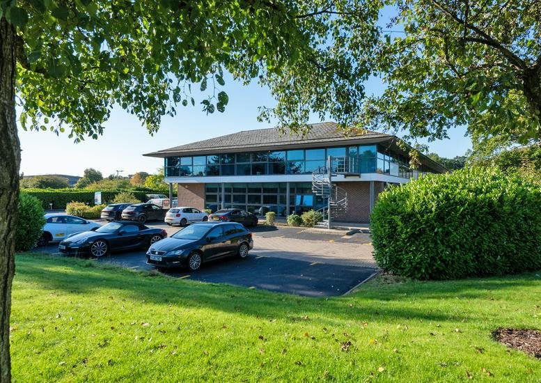 Exterior view of the two-story glass and brick facade at 1310 Parkway.