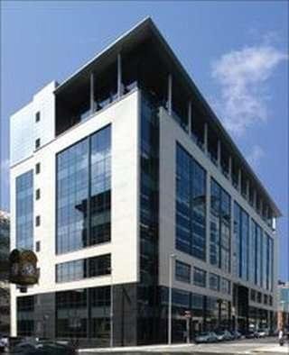 Exterior view of the modern glass and stone facade at 141 Bothwell Street, Glasgow, Scotland.