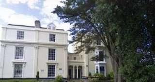 Exterior view of the historic white Georgian-style building at 147 St Helens Road, Swansea, Wales.