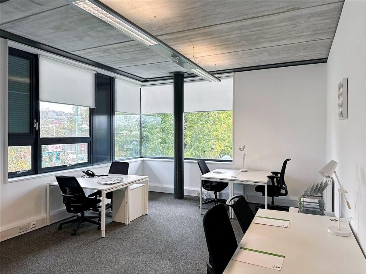 A bright office suite at 15 Jubilee Close with dual-aspect windows and ergonomic workstations.